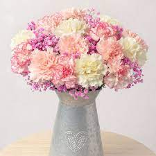 A beautiful collection of pastel coloured carnations with lilac freesias and pink alstroemeria complemented by 'rainbow' gypsophila. Pink Confetti Flowers By Post Bunches