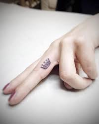 The beauty of this design is the excellent play with black patterns that form the snake's body. 1001 Beautiful Finger Tattoo Ideas And Their Meaning