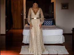 5 out of 5 stars. Bride Wore A Sparkly Gold Wedding Dress With A Plunging Neckline
