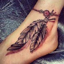 tuy dovmeleri feather tattoos panosundaki pin