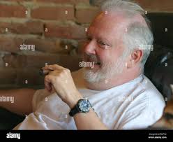 Bruce Lively sits in The Cigar Affair in Maumee, Ohio, talking about the  charges being faced by Ohio Gov. Bob Taft, Wednesday, Aug. 17, 2005. Taft  was indicted Wednesday