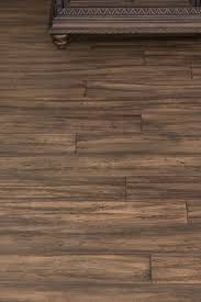Installing brown wooden bamboo hardwood boards flooring. Treehouse Fossilized Wide Tg Bamboo Flooring Bamboo Wood Flooring Bamboo Hardwood Flooring Rustic Flooring