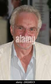 In this July 27, 2005 photo, FBI Agent Frederick Humphries, left, leaves a  news conference at the Federal Courthouse in Seattle. Humphries has been  identified as the agent socialite Jill Kelley contacted