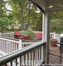 What is the best paint for a deck floor? Deck Before And After With Lodge Brown Solid Stain For The Deck And Railings Between Naps On The Porch