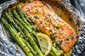 While all you really need for a satisfying piece of baked salmon is salt, pepper, and olive oil, the foil method is easy to adapt to different herbs and ingredients. Baked Salmon In Foil Packs With Asparagus And Garlic Butter Sauce Best Salmon Recipe Eatwell101