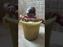 Indian traditional style baby infant bath on leg. Funny Baby Bath Indian Style Youtube