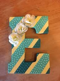 Need some awesome new decor ideas for your walls? Diy Wall Art Painted Wooden Letter With Stripes Glitter And Flowers Added For Embellish Wooden Letter Crafts Painting Wooden Letters Wooden Letters Decorated
