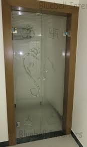Pooja Glass Door Fusion Work On Glass Ganesha Ohm Swastik Kalash Design On Door Room Door Design Pooja Room Design Pooja Room Door Design