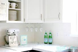 Using shiplap as kitchen backsplash. Remodelaholic Diy Budget Friendly White Kitchen Renovation With Shiplap Backsplash