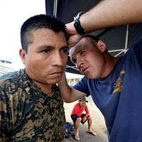 Soldiers look at graphic image displays at during the