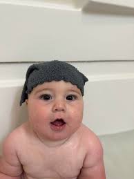 Hi please can you help me make my new Grandson look like he's working