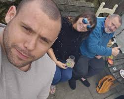 It's 1973 and my dad and his brother are taking a break from working in my  uncle's garden!