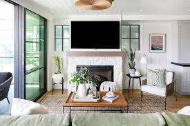 Highlight the warmth of your fireplace with surrounding tiles that reflect your home's style. Floor To Ceiling Fireplace Design Ideas