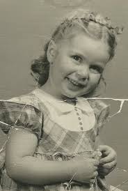 Could someone repair the rip in this photo of my mom and sister?