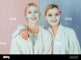 Pampering routine. Girls friends, sisters or mom and daughter chilling  making clay facial mask. Anti age mask. Stay beautiful. Skin care for all  ages Stock Photo - Alamy