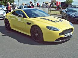 Image result for Sunburst Yellow 2012 Aston Martin