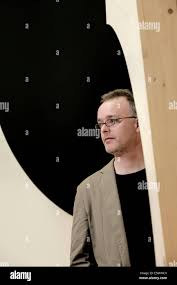 Artist, Alan Begg with his sculpture, 23.5*(degrees),