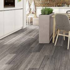 For a warm, homey look, use gray to color your kitchen floor. Prestige Varied Grey Oak 8mm V Groove Laminate Flooring 080