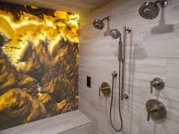 The faux onyx panels were specially selected and cut for patterning to create an organised flow across all three areas of the lap pool ceiling and the entire system is controlled by a lutron lighting system. Faux Onyx Amberlite Backlit Faux Stone