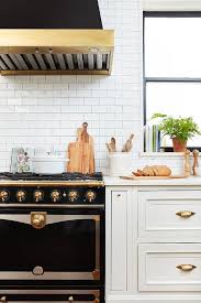 The maison la cornue tray collects juices that can compose a harmonious flavoring for accompanying dishes. White Kitchen With Black La Cornue Cornufe Range Transitional Kitchen