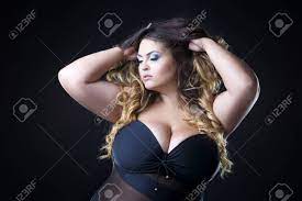 Young Beautiful Caucasian Plus Size Model With Big Breast In Black Bra, Xxl  Woman On Dark Background, Professional Makeup And Hairstyle Фотография,  картинки, изображения и сток-фотография без роялти. Image 62247815