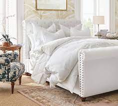 Its beautiful upholstery and cushioned padding will make your room look like a luxurious and comfortable haven to sleep in. Chesterfield Tufted Upholstered Bed With Footboard Pottery Barn