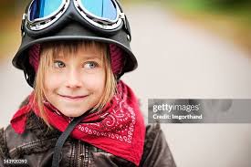 Girl On Bike With Helmet And Braces High-Res Stock Photo