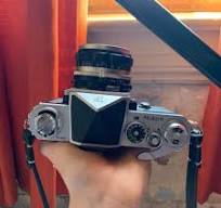 Nikon F com o visor de nível dos olhos e o visor de nível da ...