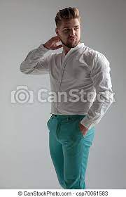 Maybe you would like to learn more about one of these? Curious Man Looking Over His Shoulder And Posing With One Hand On His Neck And The Other In His Pocket While Wearing A White Canstock