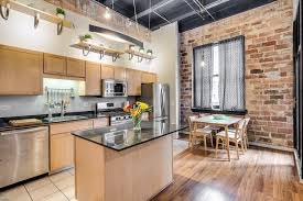 Modern Loft Kitchen With Exposed Brick Exposed Ductwork Hardwood Floors Light Wood Cabinets Open Shelving Pendant Modern Kitchen Loft Kitchen Wood Kitchen
