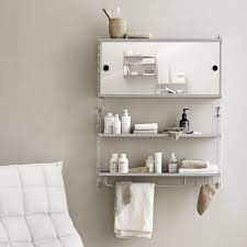 Simple yet chic, the glass bath accessories collection from hotel collection features opulent glass construction for a perfect fit in any bath space. String System Bath Bathroom Cabinet String In Metal And Mdf With Shelf And Sliding Doors Sediarreda Com