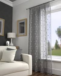 Wide fabric panels are attached to glide carriers that run concealed inside the carrier track. Buy Harrogate Leaf Embroidered Voile Net Curtain Slot Top Single Panel Online Norwood Textiles