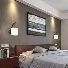 Floral wooden wall lights with a glossy finish will give your bedroom interiors a classic look. Cylindrical Bedside Wall Lamp Contemporary White Glass 1 Bulb Sconce Lighting In Black Finish Beautifulhalo Com