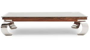 A stainless steel rectangular table, finished in satin brass, and with a bronze glass top and sides conveys relaxed glamor. Columbus Stanley Coffee Table Sterling Furniture