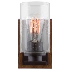 The fully customizable sedona wall sconce is part of our value oriented line of southwest lighting. Kira Home Sedona 9 Modern Rustic Wall Sconce Seeded Glass Cylinder Shade Oil Rubbed Bronze Wood Style Walnut Walmart Com Walmart Com