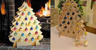 This is the perfect wine bottle tree (pictures to come). This Christmas Tree Advent Calendar Holds Mini Bottles Of Wine