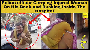Set a link back to this photo. Police Officer Carrying Injured Woman On His Back And Rushing Inside The Hospital Video Viral Youtube