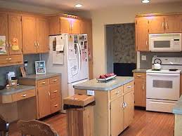 The dark blue wall paint does not make the kitchen looks boring. Kitchen Color Schemes With White Appliances