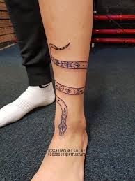 Brown skinned women will go for snake tattoo with blue ink design on the leg; Rtrud2 Art Wrap Around Snake Tattoo Some Stencil Facebook