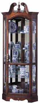 However, curio furniture is found in many modern homes, and people like the vintage look. Howard Miller 680 205 Berkshire Corner Curio Cabinet Free Shipping