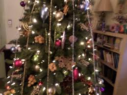 Christmas Tree With Vertical Beads Mixed Metal Ornaments Jewel Colors And Grapes Colorful Christmas Decorations Christmas Tree Themes Christmas Decorations