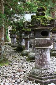 It's there in the branches of the black pines trimmed in bonsai style, in. Japanese Garden Toro Japanese Garden Japanese Stone Lanterns Japan Garden