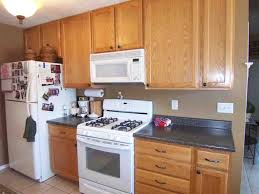 Kitchen Colors With Oak Cabinets And Black Countertops Oak Kitchen Cabinets Oak Kitchen Honey Oak Cabinets