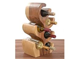 Whether you're holding red or white wine, you want a wine rack that will fit the style of your home, be it modern, rustic, or reclaimed. Unique Carved Wood Wine Bottle Holder