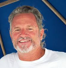 Captain Lance Holmquist "I had a dive operation in Australia, I used to  take people out to The Great Barrier Reef and I had a barge I used to take  people up