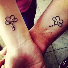 Very fine tattoo with hearts framed in flowers for the best friend. Friendship Heart Tattoos 100 1k Tattoos For Lovers Couple Tattoos Couple Tattoos Love