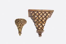 A wall sconce is a decorative way to add supplemental light to any space or room in your home. Lot Two Decorative Wall Sconce Shelves