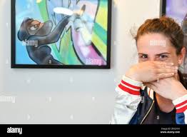 Artist MadC (L) with Mark Bode (R) at the opening ceremony of his  exhibition "Mark et Vaughn Bode : 50 years of Hip Hop and Bode" at the  Villa Molitor, Hotel Gallery