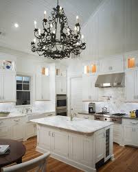 High cathedral ceiling gives emphasis on the simplicity of one of the most functional and beautiful kitchens we've designed so far. Vaulted Ceiling Kitchen Transitional Kitchen Pulliam Morris Interiors