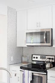 The white grout lines add a crisp and organised feel to the backsplash wall. White Hex Tile With Black Grout Backsplash Room For Tuesday